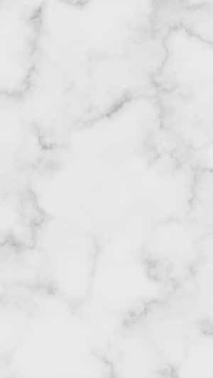 帶有灰色紋理的白色大理石表面，適合優雅的室內設計。 — 冬日美學 壁紙