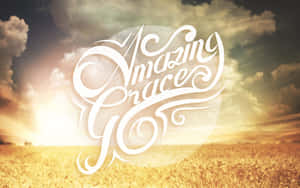 優雅的白色字體在日落時分的金色麥田上寫著 Amazing Grace。 — 耶穌基督 壁紙