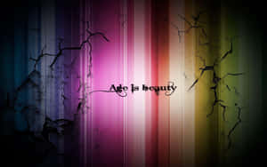 帶有裂紋的彩虹漸變背景，以風格化文字呈現短語 age is beauty。 — Steam Deck OLED 壁紙