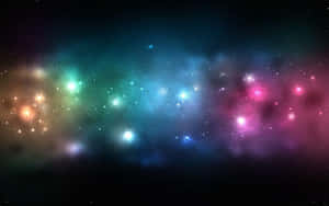 深空中色彩繽紛的星雲和恆星，伴隨著發光的雲氣。 — 夜空 壁紙