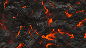 熔岩流經裂開的黑色火山岩，散發出強烈的橙色熱光。 — 熔岩龍 壁紙