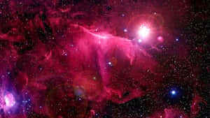在深空中帶有發光星星和鏡頭光暈的充滿活力的粉紅色和紫色星雲。 — 太空美學 GIF 壁紙