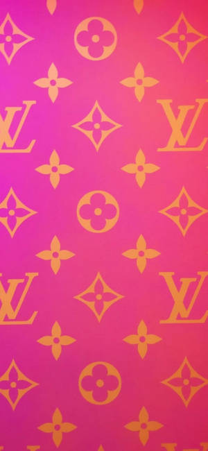 帶有金色 Louis Vuitton 字母組合圖案的粉紅色漸變背景。 — Galaxy S26 壁紙