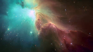 一個色彩繽紛的星雲，帶有發光的雲層和散佈在深空中的恆星。 — 銀河 壁紙