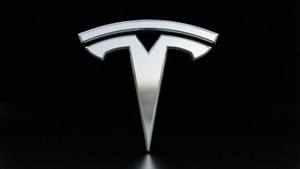 黑色背景上帶倒影的閃亮Tesla標誌 — Tesla GIF 壁紙