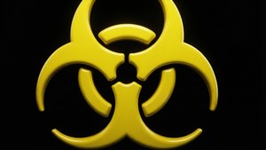 黑色背景上發光的黃色生物危害標誌