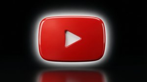 光澤的紅色 YouTube 播放按鈕圖標，白色中心在黑色背景上發光