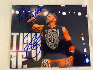 摔角手 Christian Cage 在場館向粉絲揮手的簽名照片。