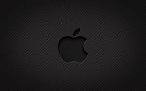 碳纖維背景上的黑色Apple標誌