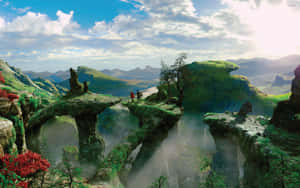 兩個人站在浮石上，下方是霧氣瀰漫的峽谷，有瀑布和遠山。 — 黎明 壁紙