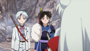 兩個動漫戰士手持劍，站在岩石峽谷中，面對一個對手。 — Himiko toga GIF 壁紙