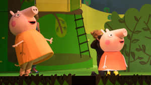 兩名穿著Peppa Pig服裝的演員在兒童劇院舞台上。 — 馬 壁紙