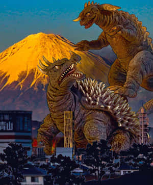 兩隻巨型怪獸在城市上空戰鬥，背景有富士山。 — Apple Watch Ultra 壁紙