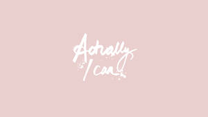 粉紅色背景上以白色書法字體寫成的勵志語句「Actually I can」，附有星形濺墨。