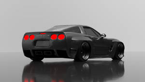 黑色Corvette跑車，紅色尾燈，在攝影棚反射地板上。