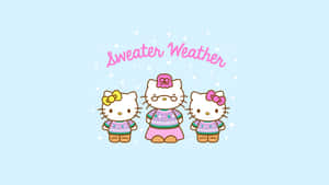 三個穿著毛衣的Hello Kitty角色在雪景中。
