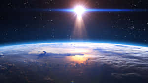 從太空看到的地球，太陽照耀在雲層和海洋上。 — 太空 壁紙