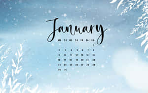 一月日曆，在藍色水彩背景上帶有雪花和霜凍樹枝。