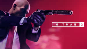 Hitman 2刺客在紅色燈光下瞄準消音手槍