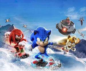 Sonic、Knuckles 同 Tails 喺雪山玩滑雪板，Eggman 嘅機械人喺後面追。 — 動畫 壁紙