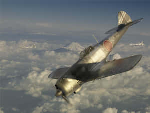 三架復古日本戰鬥機在雲層上飛行，背景是富士山。