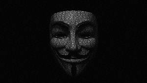 一個由文字組成的白色 Guy Fawkes 面具，背景為深色。