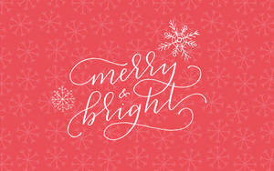 珊瑚色背景上帶有雪花的 Merry and bright 節日問候。