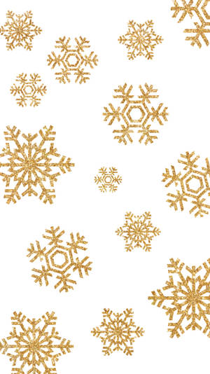 金色閃粉雪花散落在白色背景上。