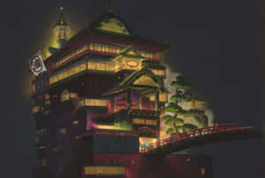 夜晚發光的日本建築，帶有紅色橋樑和溫暖燈光。