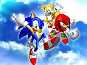 Sonic、Tails 同 Knuckles 喺有雲嘅晴朗天空飛翔。 — 卡通 壁紙
