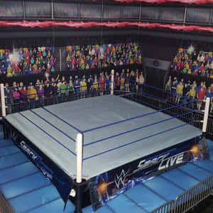 WWE SmackLive摔角擂台與場館中歡呼的人群壁畫。 — 摔角 GIF 壁紙