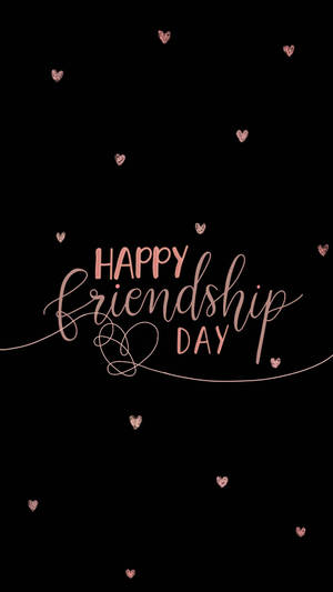 黑色背景上帶有玫瑰金心形的Happy Friendship Day訊息。