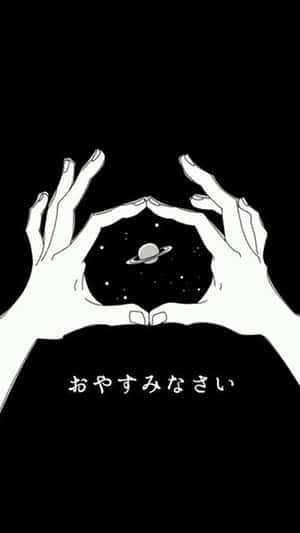 手在帶有光環和星星的行星周圍形成心形。