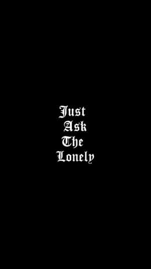 黑色背景上寫有 Just Ask The Lonely 的白色哥德式文字