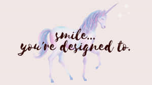 一隻粉彩水彩獨角獸，帶有「smile you're designed to」字句。 — 可愛卡通 壁紙