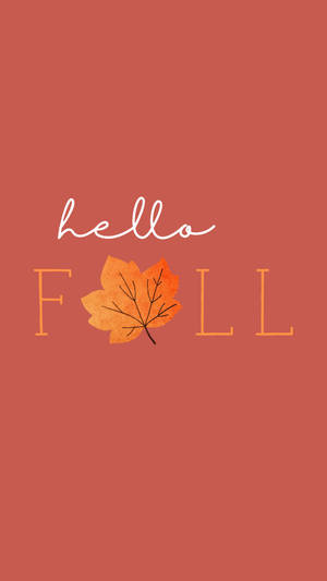 陶土色背景上帶有橙色楓葉的Hello Fall文字。