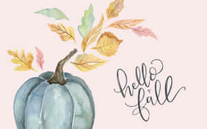 藍色南瓜配秋天的樹葉和草書hello fall文字。
