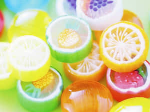 色彩繽紛的軟糖，形狀像水果片和莓果。 — 可愛 壁紙