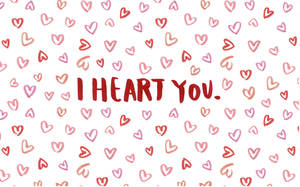 紅色文字寫著「I HEART YOU」，周圍散落著粉紅色和紅色的心形。