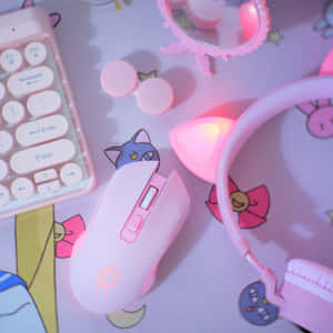 卡通主題桌上的粉紅色遊戲裝備，帶有發光點綴。 — 電腦 GIF 壁紙