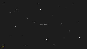 深色背景上有白色雪花點點和置中的文字 let it snow。 — 冬日美學 壁紙