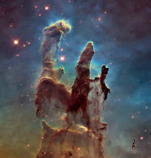 天鷹星雲中發光的宇宙柱，周圍環繞著星星