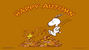 史努比跳過一堆秋葉，胡士托探出頭來，上方有「Happy Autumn」文字。