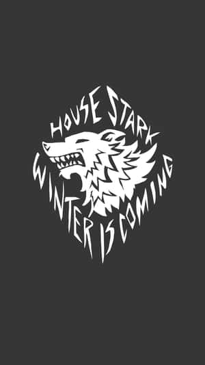 白色House Stark冰原狼徽章，帶有winter is coming文字，背景深灰色。