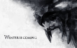 冰原狼剪影，帶有「Winter is Coming」文字，以冰冷單色風格呈現。 — 寒冷 壁紙