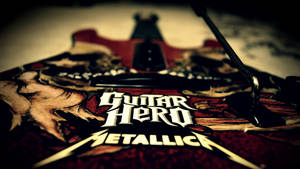 Guitar Hero Metallica 電子遊戲控制器，帶有詳細藝術品和溫暖燈光。