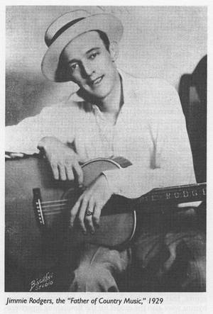 Jimmie Rodgers 在 1929 年的復古錄音室肖像中拿著結他。 — 阿隆·羅渣士 壁紙