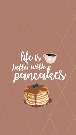 一堆煎餅配上糖漿和藍莓，旁邊放著一杯咖啡，並有文字 life is better with pancakes。