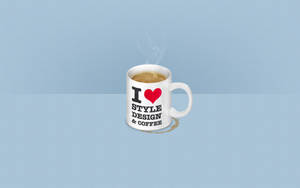 白咖啡杯，上面有「I heart style design & coffee」文字，淺藍色背景。