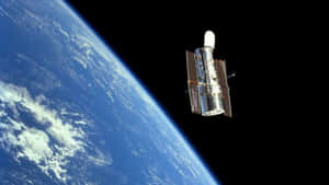 哈勃太空望遠鏡在軌道上漂浮在地球上方 — 銀河系 壁紙